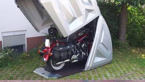 Weatherproof and lockable garage for motorcycle, quad, e-bike or e-scooter